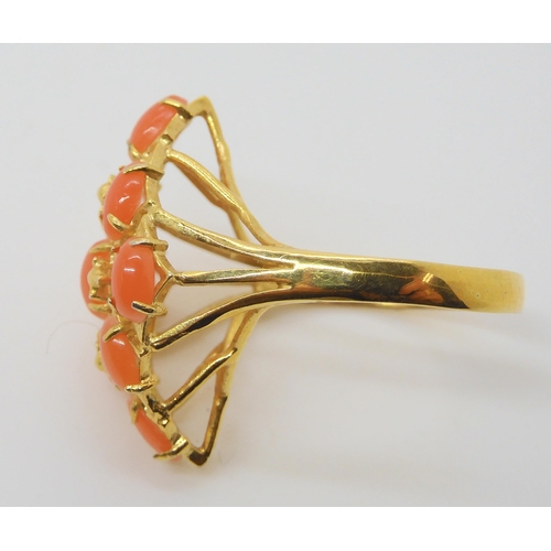 681 - A bright yellow metal coral cluster ring, the shank stamped K18, size O, weight 2.4gms