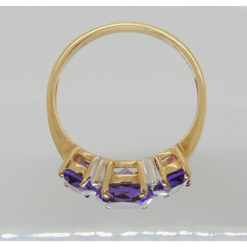 686 - A 9ct gold three amethyst and diamond accent ring, size P1/2, weight 3.2gms