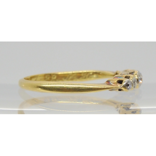 692 - An 18ct gold five stone diamond ring, set with estimated approx 0.15cts of old cut diamonds, size L1... 