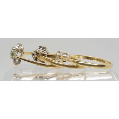 694 - Three 9ct gold rings, a cz solitaire size Q, emerald cluster size Q1/2, and a sapphire and diamond a... 