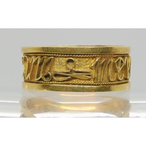 695 - A bright yellow metal band ring, with a pattern of the signs of the Zodiac, size U, weight 4.7gms