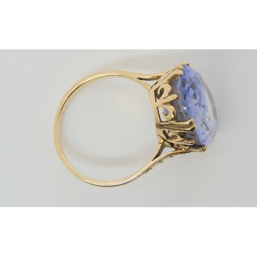 696 - A 9ct gold blue glass gem statement ring, size R, weight 7.6gms