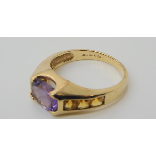 697 - A 9ct gold amethyst and citrine ring, size O, weight 3.6gms 