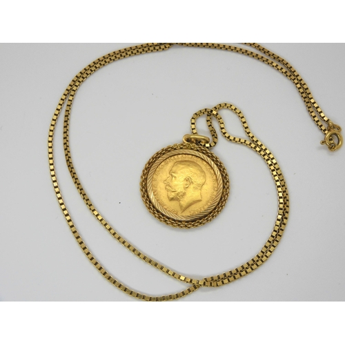 703 - A 1911 gold full sovereign in a 18ct gold pendant mount together with an 18ct gold box chain, length... 