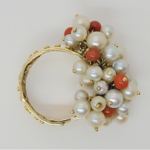 714 - A 14k gold filligree coral and pearl cluster ring, together with matching earrings