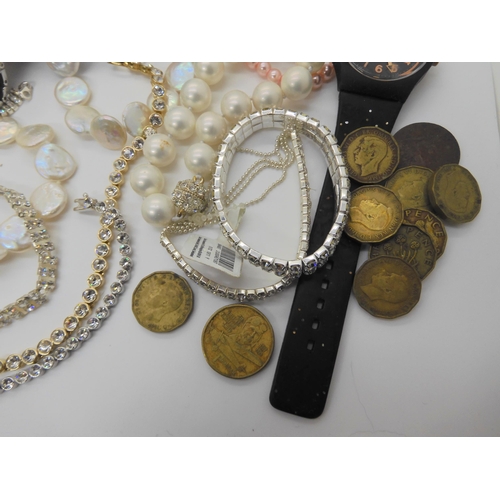 718 - A collection of thrupenny bits, costume jewellery and watches to include a button pearl necklace and... 