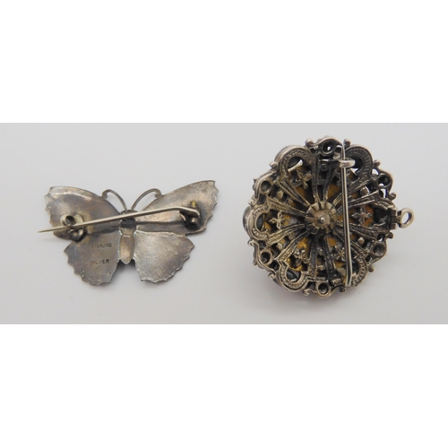 733 - A blue enamelled butterfly brooch, stamped sterling silver to the back, together with a white metal ... 