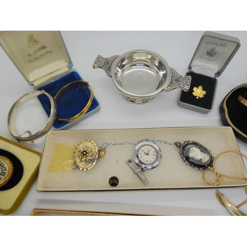 734 - A silver engraved bangle, a ladies vintage bangle watch in original box From Watches of Switzerland,... 