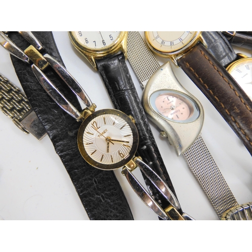 738 - A large collection of fashion watches to include Swatch