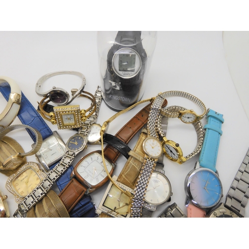 738 - A large collection of fashion watches to include Swatch