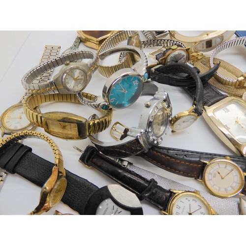 738 - A large collection of fashion watches to include Swatch