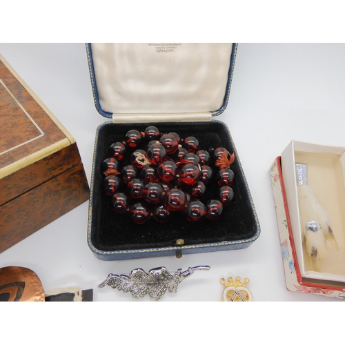 748 - A string of cherry amber colour beads, weight 72.3gms, each approx diameter 14.1mm, and a collection... 