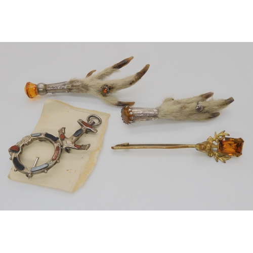 749 - A collection of Scottish themed jewellery to include two grouse foot brooches, two Scottish agate br... 