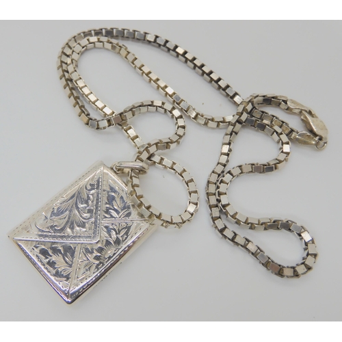 750 - A silver envelope style locket, hallmarked Birmingham 1938, silver and white metal brooches, and a r... 