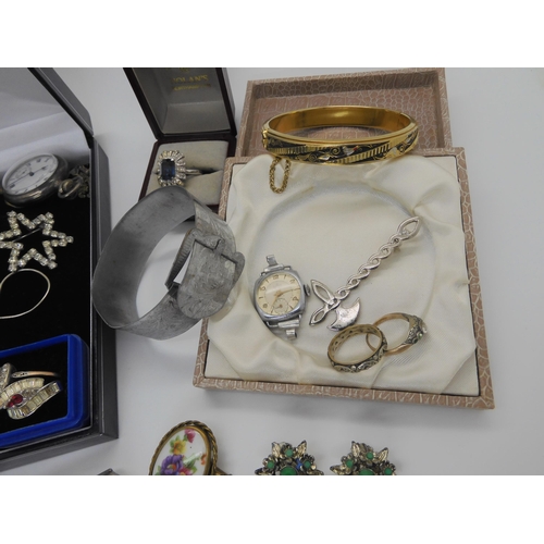 757 - A silver infinity bangle, engraved with the Lord's prayer, a silver fob watch, given as a Dux Medal ... 