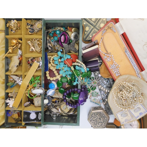 761 - A large collection of vintage costume jewellery, an evening bag and other items