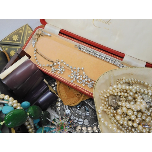 761 - A large collection of vintage costume jewellery, an evening bag and other items