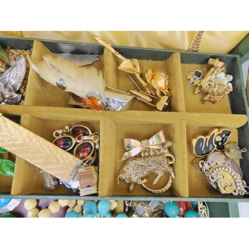 761 - A large collection of vintage costume jewellery, an evening bag and other items