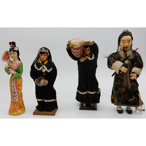 501 - A lot comprising two Norah Welling dolls, various wooden dolls in ethnic dress, Matryoshka style Rus... 