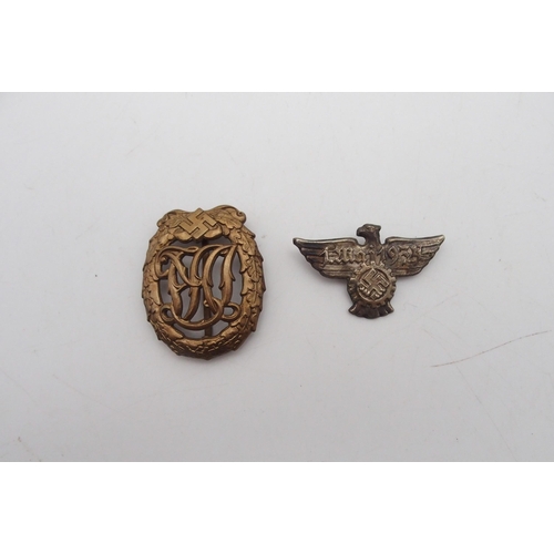 533N - A German J. Mai 1933 tin badge and a Deutches sports badge