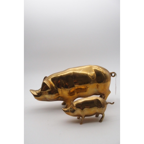 558 - A brass piggy bank and a brass piglet