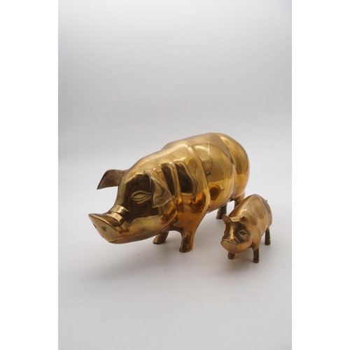 558 - A brass piggy bank and a brass piglet