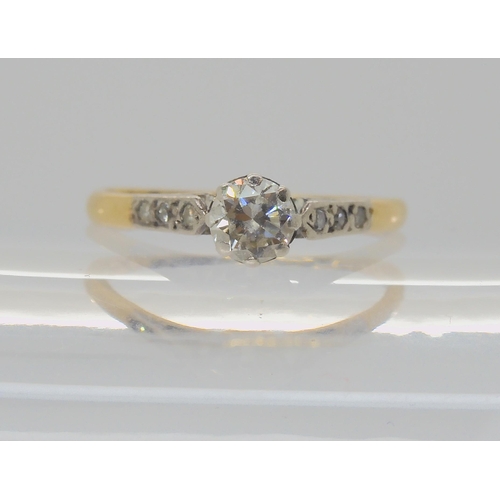 617 - An 18ct and platinum diamond solitaire ring set with an estimate approx 0.35ct diamond with diamond ... 