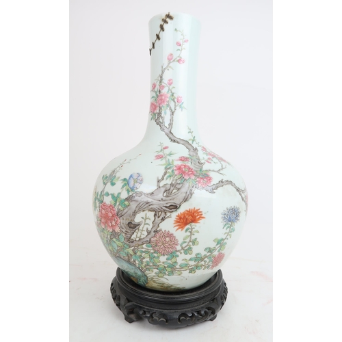 311A - A CHINESE FAMILLE ROSE BALUSTER VASEpainted with dragon and butterflies above a blossoming tree surr... 