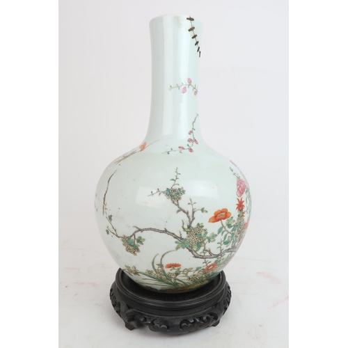 311A - A CHINESE FAMILLE ROSE BALUSTER VASEpainted with dragon and butterflies above a blossoming tree surr... 