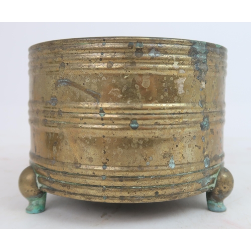 313A - A CHINESE ARCHAIC STYLE BRASS CENSER cast with horizontal bands, seal mark and on three feet, w... 