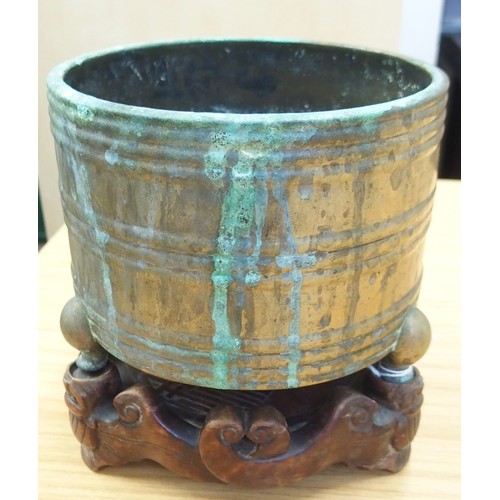 313A - A CHINESE ARCHAIC STYLE BRASS CENSER cast with horizontal bands, seal mark and on three feet, w... 