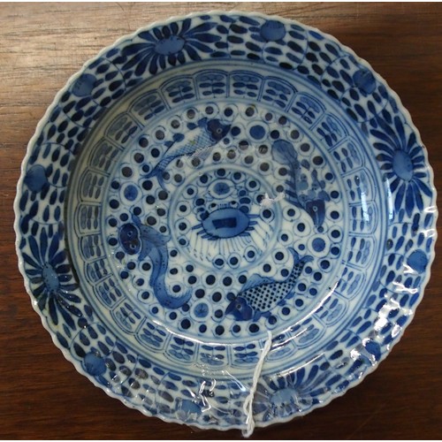 323 - A CHINESE BLUE AND WHITE DISHpainted with precious objects, within a foliate band, 27.5cm diameter, ... 