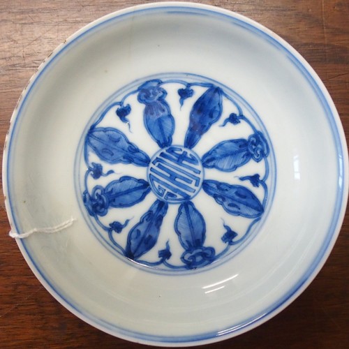 323 - A CHINESE BLUE AND WHITE DISHpainted with precious objects, within a foliate band, 27.5cm diameter, ... 