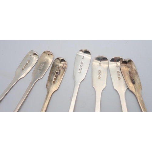 436 - A collection of silver fiddle pattern dessert spoons including four by William Eaton, London 1815, a... 