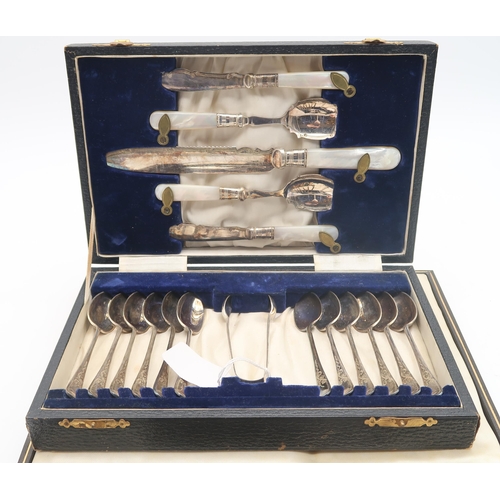 451 - A cased set of silver and stainless steel cutlery, comprising two trios of knives, forks and spoons,... 