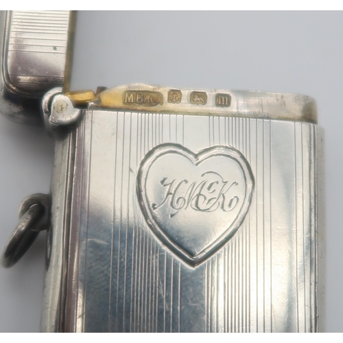 452 - A collection of vestas including two silver examples,  one with engine turned decoration surrounding... 