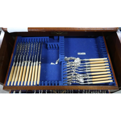 457 - A mahogany four drawer canteen of silver plated cutlery, some knives silver collared, spoons and for... 