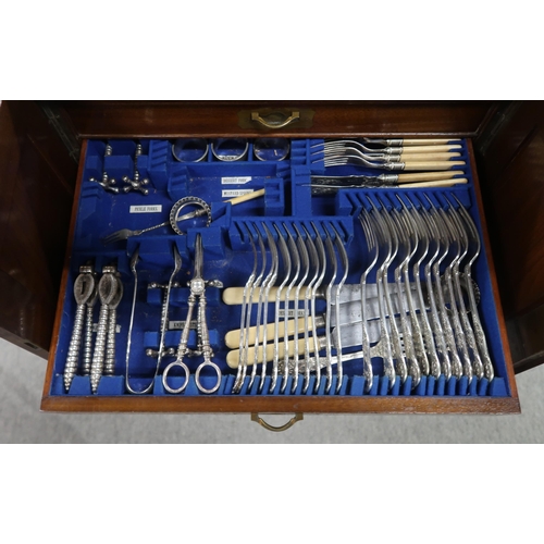 457 - A mahogany four drawer canteen of silver plated cutlery, some knives silver collared, spoons and for... 