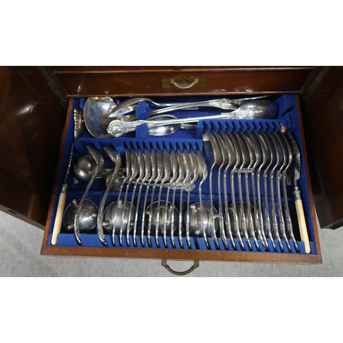 457 - A mahogany four drawer canteen of silver plated cutlery, some knives silver collared, spoons and for... 