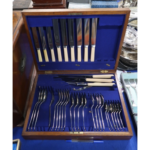 457 - A mahogany four drawer canteen of silver plated cutlery, some knives silver collared, spoons and for... 