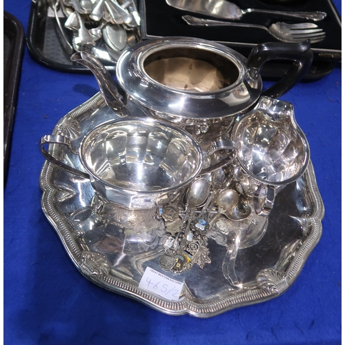 465 - A collection of EPNS including a three piece tea service, souvenir spoons, a shaped tray with engrav... 