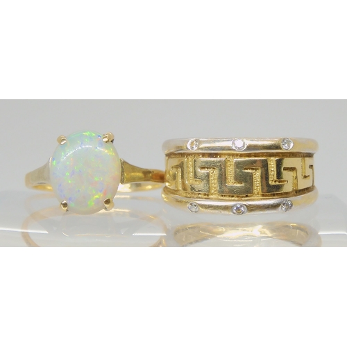 A 9ct yellow and white gold key pattern ring set with diamond accents, size J1/2 together with a 9ct