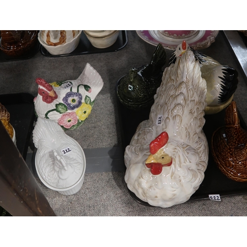 222 - A collection of nine pottery hen egg nests and a pottery model of a hen