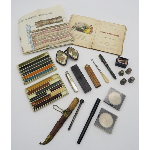 556 - Assorted collectable items, to include silver and white metal thimbles, a cased Sheffield silver and... 