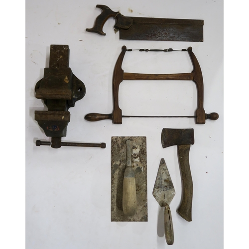 649D - A Woden bench vice, with a small collection of vintage tools, including a fret saw, a tenon saw, a h... 