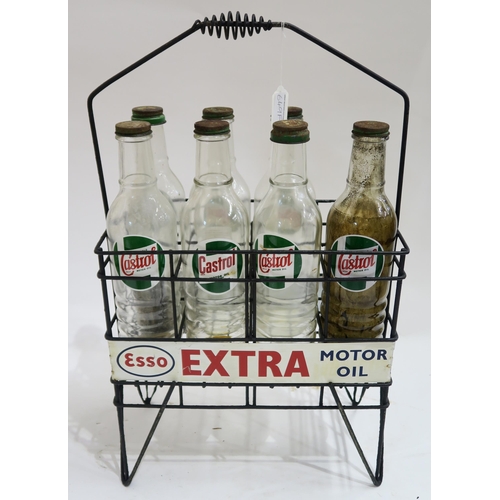 649F - AUTOMOBILIAAn Esso Extra Motor Oil advertising stand/bottle carrier, with seven Castrol Motor Oil gl... 