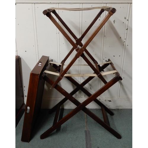 10 - An early 20th century mahogany luggage stand, butlers tray and two folding tray stands (3)