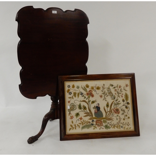 11 - A Victorian mahogany tilt top table with turned tripod base and a framed tapestry (2)