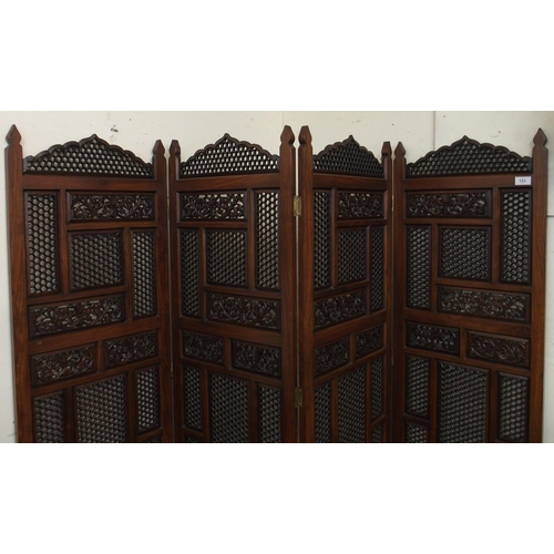 123 - A 20th century Oriental hardwood fretwork four fold room divider