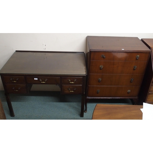 150 - An early 20th century mahogany writing desk and a mahogany chest of four drawers (2)